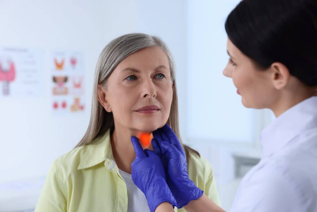 Older woman having a consultation with her endocrinologist in preparation for hormone therapy to improve her skin
